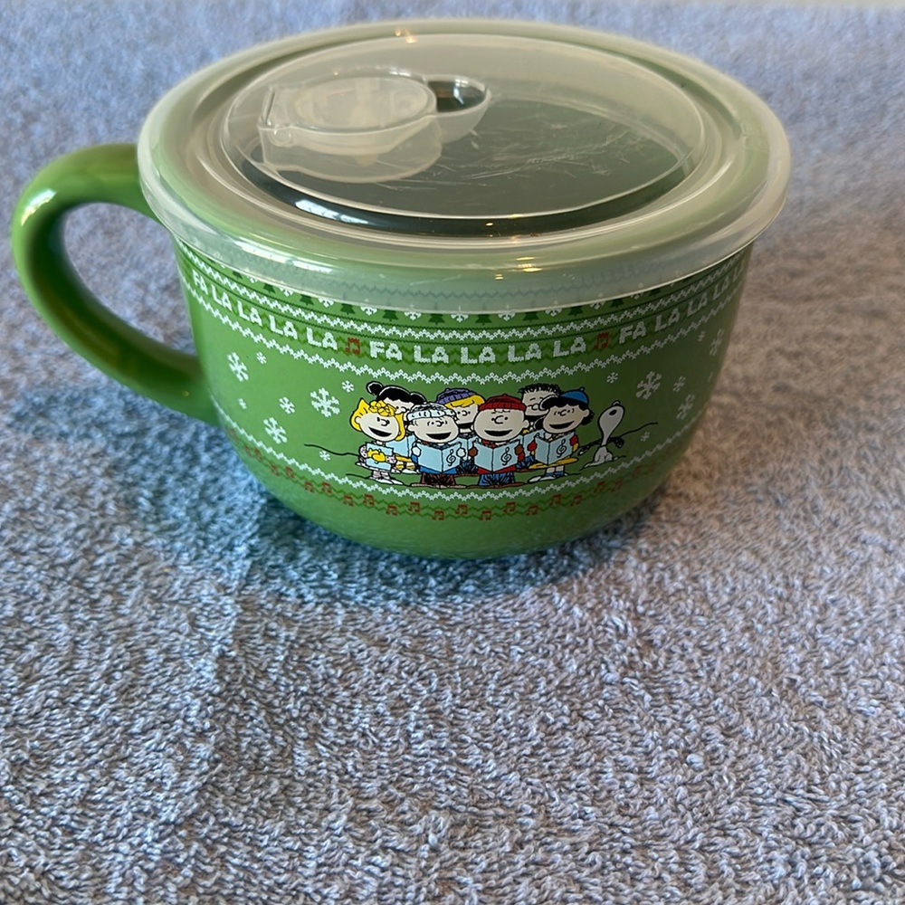 Peanuts soup container, or oversized coffee cup.